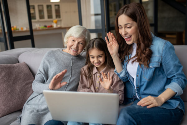 The image shows the a family is on online call with their beloved one.