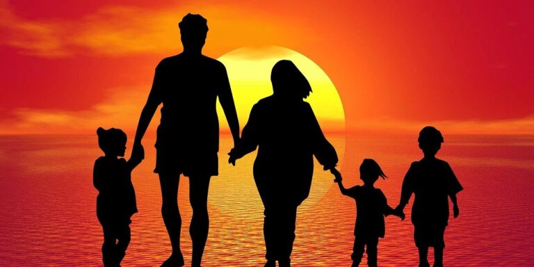 family members watching sunset
